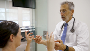 Doctor talking to patient about pain management. (c) UC Davis Regents. All rights reserved.