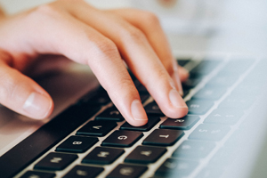 Person typing on computer. (c) UC Davis Regents. All rights reserved.