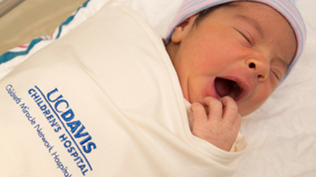 newborn in sleep sack