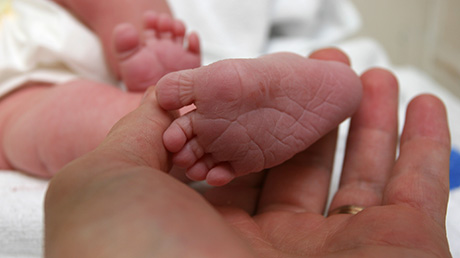 cuddling newborn