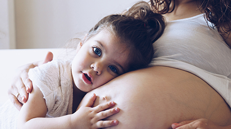 pregnant woman and daughter