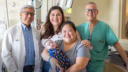 Elizabeth and her son Carter with his surgeons