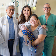 Elizabeth and her son Carter with his surgeons