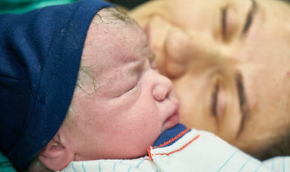 Mom next to baby in hospital bed. (c) All rights reserved.