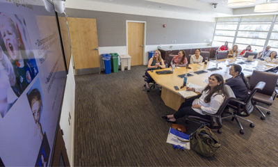 A Project ECHO® team at UC Davis Health holds a monthly educational session via teleconference. (c) UC Regents. All rights reserved.