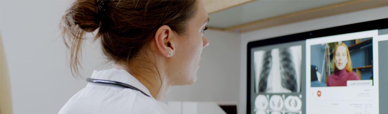 Doctor conducts a telehealth visit on a computer. (c) UC Davis Regents. All rights reserved. 