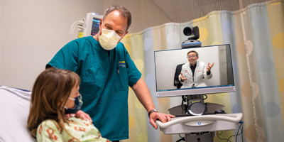 Dr. James Marcin conducts a telehealth visit. (c) UC Regents.