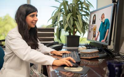 Sunpreet Kaur conducting telehealth visit. (c) UC Davis Health. All rights reserved.