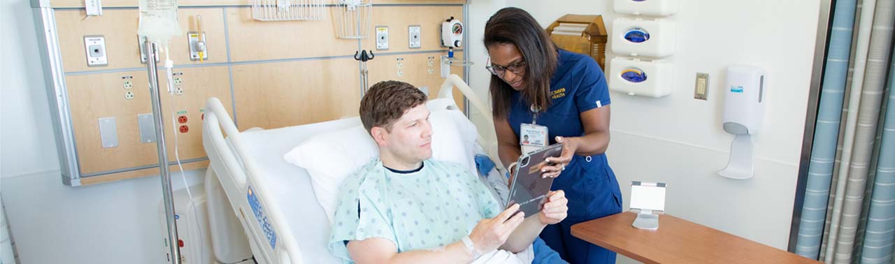 Doctor conducts a telehealth visit on a phone. (c) UC Davis Regents. All rights reserved. 