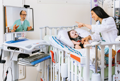 Pediatrician Dr. Fruzza cares for a patient. (C) UC Davis Regents. All rights reserved.