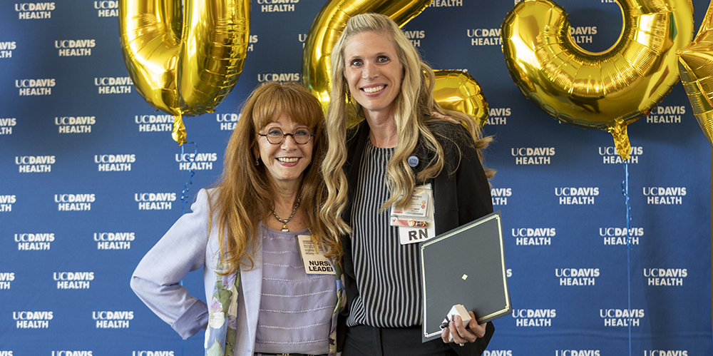 Wendy Willson congratulating Jennifer Sturges 