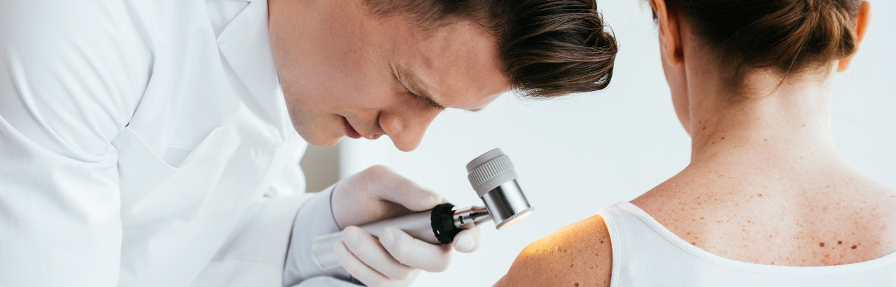 Dermatologist inspects a patient's skin (c) UC Regents. All rights reserved.