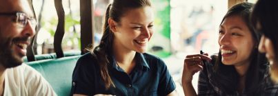Four people talking together and laughing (c) UC Regents. All rights reserved.