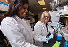 researchers in a lab