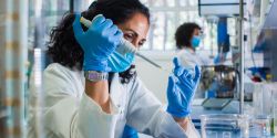 Researcher in a laboratory (c) UC Regents. All rights reserved.