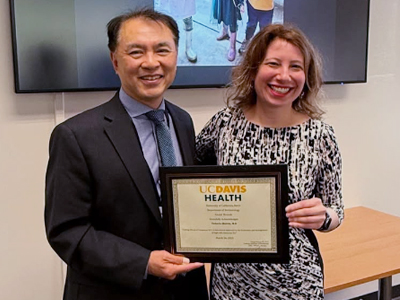 Samuel Hwang and Victoria Sharon at a grand rounds event (c) UC Regents. All rights reserved.