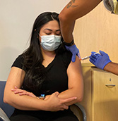 Woman getting a COVID booster shot