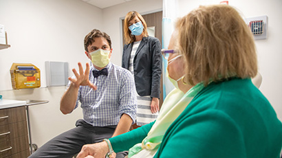 Dr. David Bissig and patient in the clinic