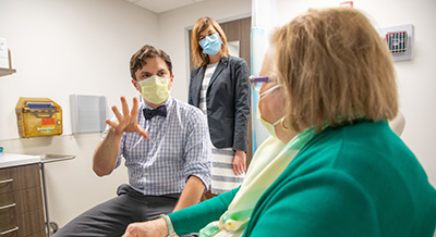 Doctor with older patient