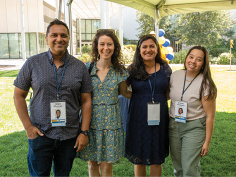 Hasan Khashwji (M.D. ’13), Aarti Rao (M.D. ’13), and Chelsey Villanueva (M.D. ’13) take a break during family-friendly activities under the tent.