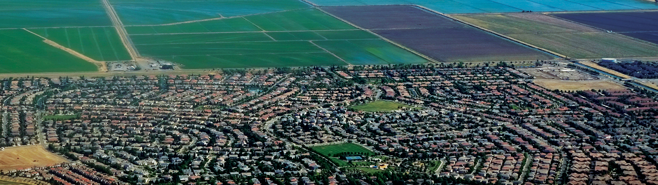 Fields and housing abut in the Central Valley. A third of the region’s schools are within a quarter mile of ag pesticide applications.