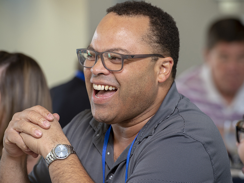 Ben Rodgers (M.D., ’98) sharing a laugh with current students at the annual mentorship lunch.