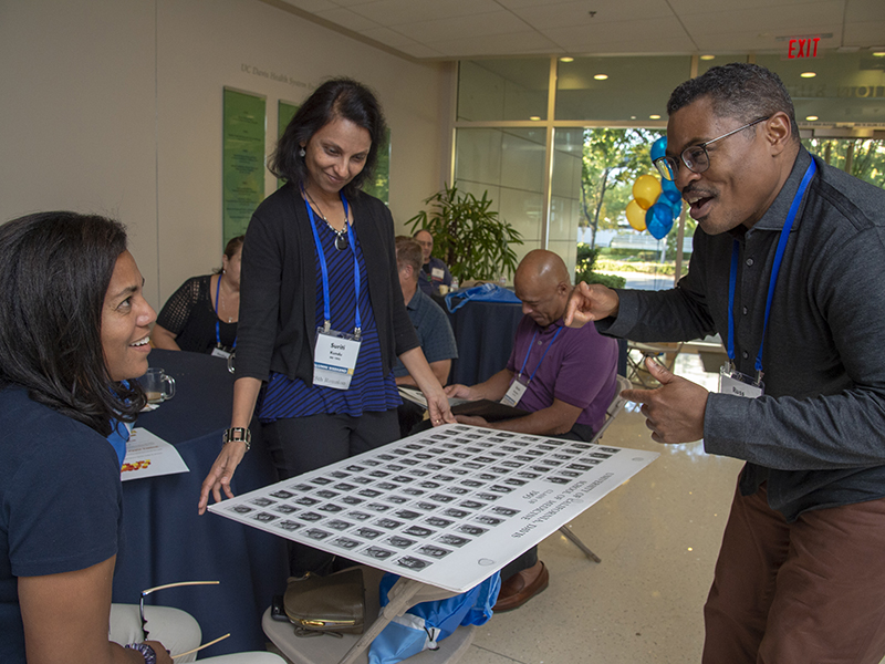 Reminiscing with (R to L, this frame only): Russ Buchanan, Kevin Bowman, Suriti Kundu (all M.D.,’93) and Kevin's wife Lynn Bowman.