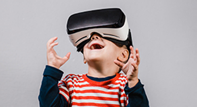 boy wearing virtual reality goggles