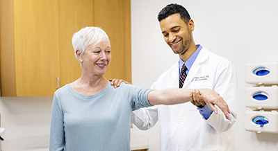 Dr. Christopher Bayne with patient