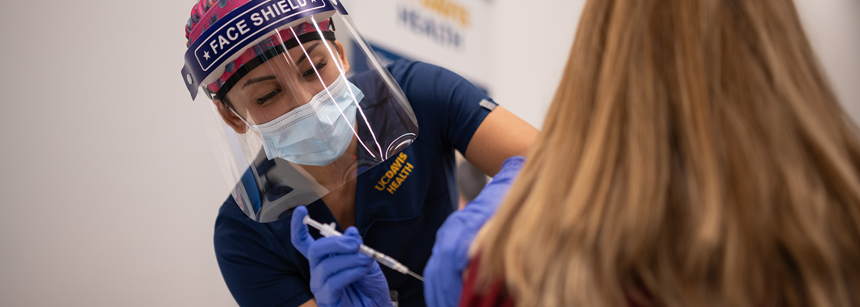 UC Davis Health nurse administering vaccine