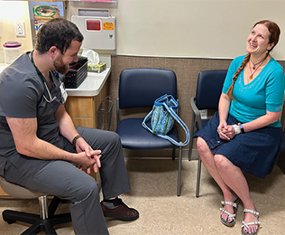 Brandon Drws meets with his patient at Cascades East Family Medicine Center