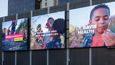 Downtown Commons at Golden 1 Center with a Believe in Better billboard