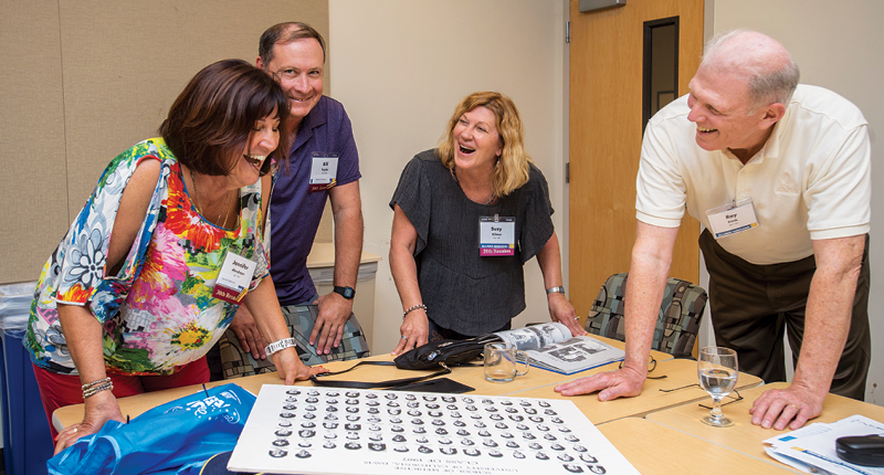 Class of 1987 members enjoy class portraits from three decades ago.