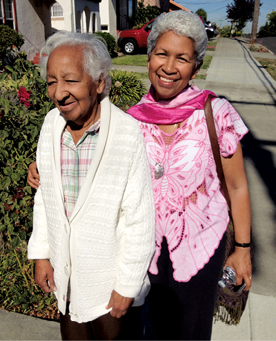 Edda Caraballo walking with her mother