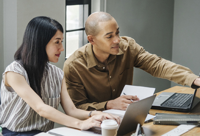 Two people looking at a computer. (C) Pixabay. All rights reserved.