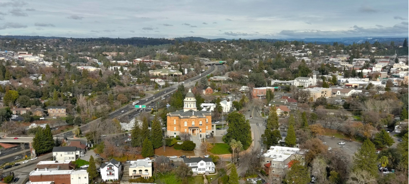 aerial view of downtown Old Auburn, CA with a view of the Sierra Nevada mountains