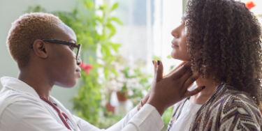 Doctor examines patient. (c) All rights reserved. UC Davis Regents.