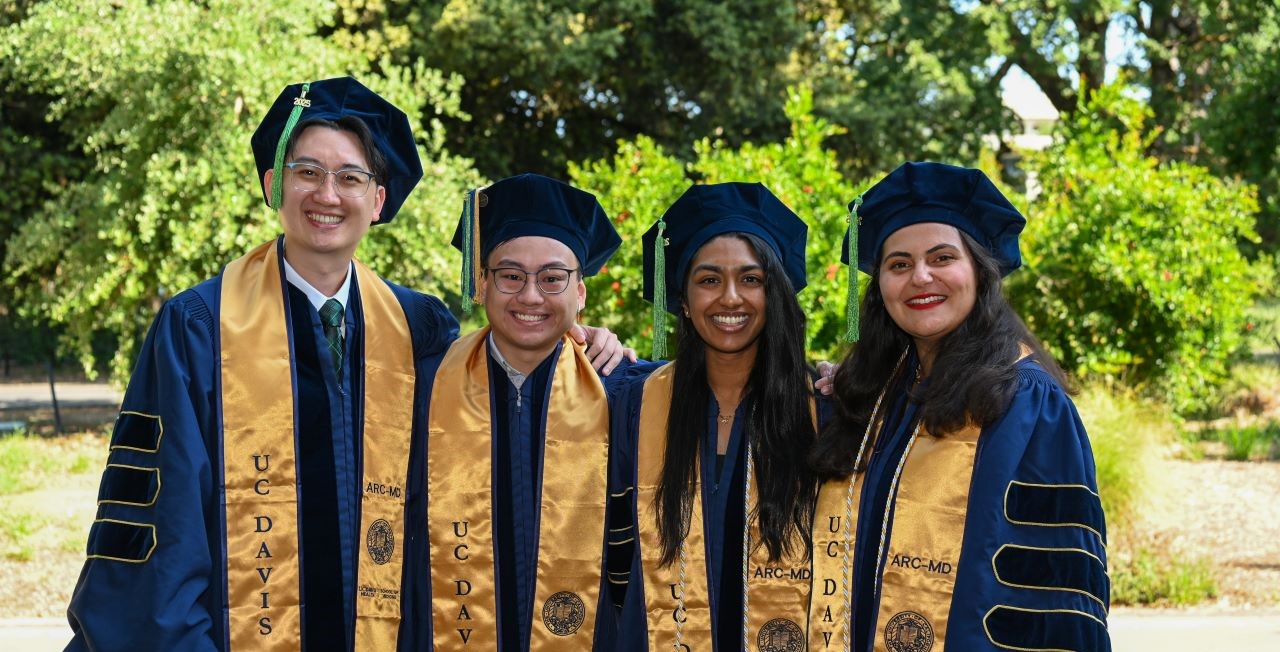 ARC-MD Students standing in graduation attire