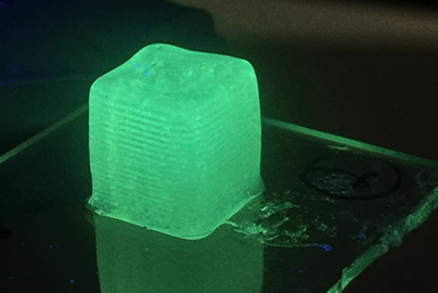 A cube of 3D printed flexible material.