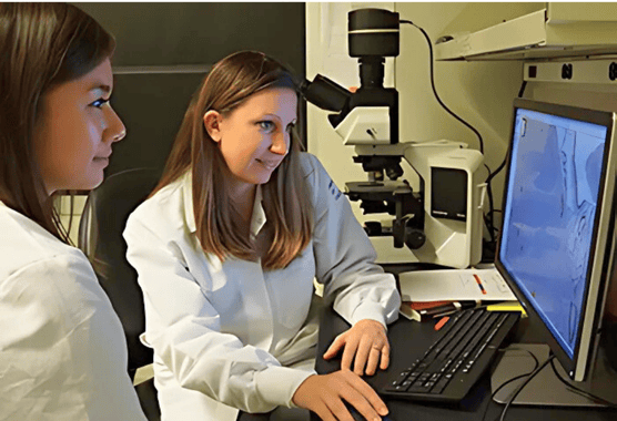 Scientists and trainee looking over data