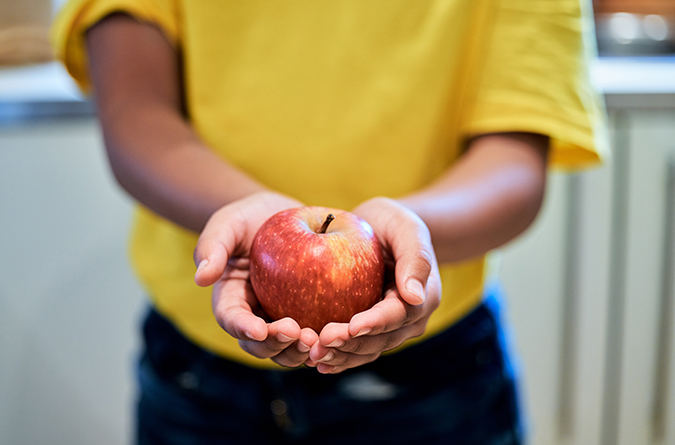 child with apple