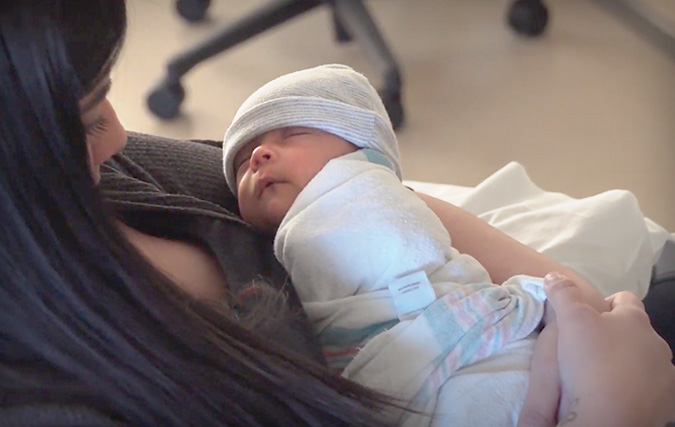 Mom holding her infant