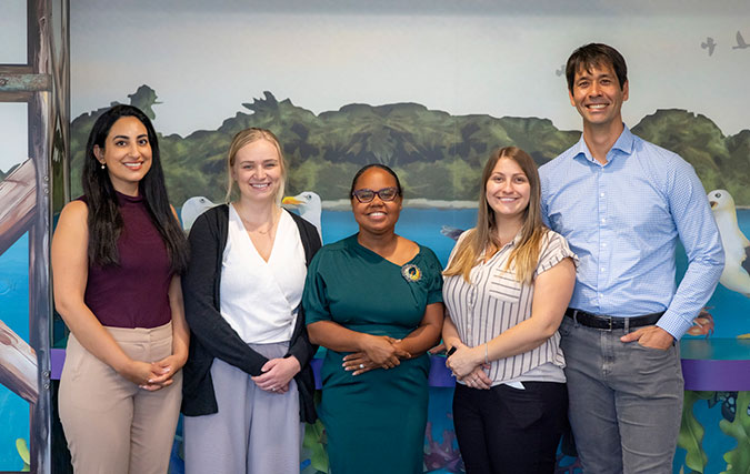 Five Adolescent Medicine staff side by side posing for photo, four women and 1 male staff