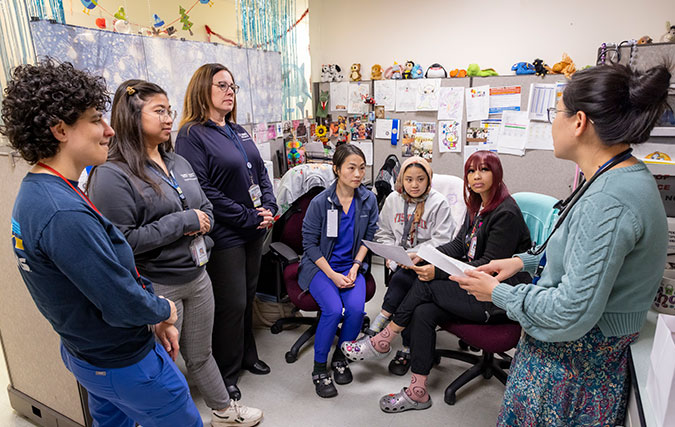 Circle Clinic staff meet in office