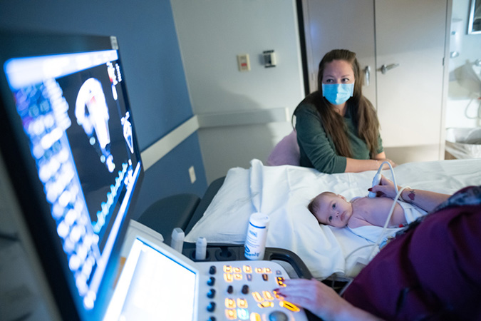 Tabitha Downs with daughter Savannah who is being assessed by doctor