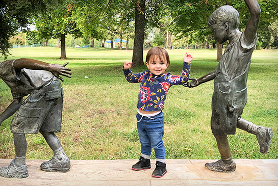 Jadyn, pediatric heart patient, healthy and playing outdoors