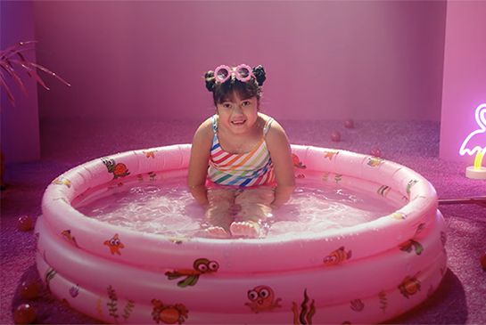 Audrey playing in kiddie pool