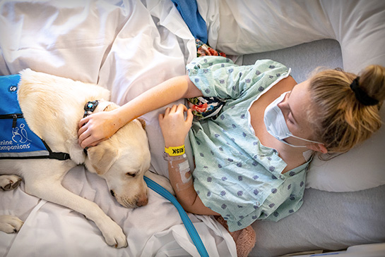 Emmie Arnold with facility dog