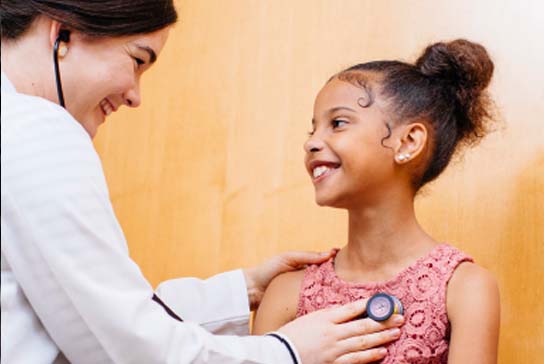 Pediatric doctor with a girl