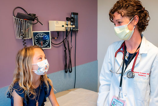 Pediatrician with young patient
